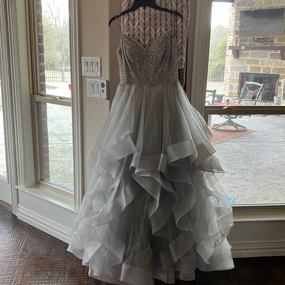 Woman’s size 4 (may need tailoring) silver prom dress.